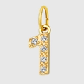 Macro detail of a gold-plated number 1 pendant featuring five sparkling cubic zirconia gems - Number 1