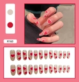Detail view of R160 press-on nails featuring red and white hearts on nude pink base - Nude Pink Double Heart Long Style (R160)