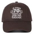 Detail of white embroidery on dark brown cotton cap with 70th birthday celebration text - Coffee