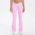 Front view of pink flared yoga pants showing high-waisted V-shaped crossover design with white trim - Sakura Pink