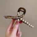 Detailed shot of a luxury hair claw clip with sparkling rhinestones and white pearls - Pearl & Rhinestone Linked Decoration 13CM
