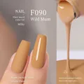 Plant-based gel nail polish in warm caramel ginger yellow shade F090 with matte and glossy finish - F090 Wild Chrysanthemum