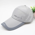 Side view of light grey quick-dry baseball cap with Modern British Sports text and long brim - Adjustable / Waterproof Grey