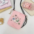 Pink drawstring bucket bag with cat embroidery displayed with cute pastel accessories - Pink (Bib Cat)