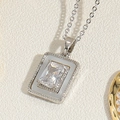 Macro detail of silver heart necklace pendant with rectangular zircon and white enamel inlay - Silver Tone White Zirconia Style (XL2666)