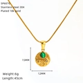 Macro detail of 18K gold-plated stainless steel sun and moon pendant with green stone - Celestial Malachite Style (SP607G)