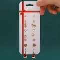 Christmas earring set with Santa hats and snowflakes on a festive holiday display card - 59 Small Hat (9 Pairs Set)