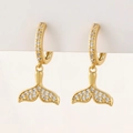 Detailed view of gold whale tail earrings pavé-set with sparkling cubic zirconia crystals - F-Whale Tail