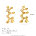 Macro view of 18K gold plated stainless steel constellation earrings with zircon stone - Sagittarius