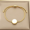 Detail of adjustable gold snake chain bracelet featuring white cabochon stone center - White Marble Pattern Style (KB205516 -GC)