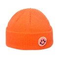 Detailed knit texture of orange ribbed beanie with pink smiley face patch detail - M(56-58cm) / Orange