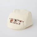Close-up of three bears embroidery and motivational text on a beige cotton beret cap - 48cm (6 Months-2 Years) / Off-white