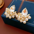 Detail of drop crystal earrings with white pearls on a blue leather jewelry box - Gold (Silver Earring Post)