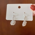 Silver drop earrings with white pearls and shell-shaped charms on a display card - Petal Drop Earrings