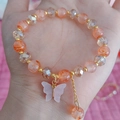 Pink butterfly charm beaded bracelet with cracked stone beads and golden spacers - Orange