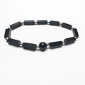 Minimalist beaded bracelet with black rectangular stones and silver spacer beads on white background - Obsidian