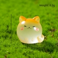 Orange luminous cat miniature figurine on moss background with dimensions 2.4cm by 2.3cm - Orange (Long Tail Kitten)