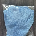 A pair of blue textured exfoliating bath gloves packaged in a clear plastic bag - 6 Pcs Set / Blue