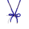Handmade necklace with blue faceted crystal beads and a golden bow pendant - Deep Sapphire Blue Transparent