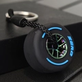 Creative black soft rubber tire keychain with a blue ZERO print and colorful plated rim - Blue