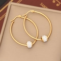 Detail of gold hoop earrings featuring a movable bead with pavé sparkling crystals - Egg Shape (7#)