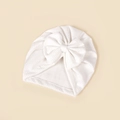 Close-up of white waffle knit texture and large handmade bow on baby turban hat - 18.5x17cm / White
