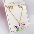 Macro view of golden butterfly jewelry set with colorful enamel wings and artistic details - Set 2716 Gold Butterfly