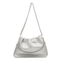 Silver metallic cloud clutch bag with chain strap and soft pleated texture on white background - Silver