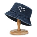 Dark blue washed denim bucket hat featuring white heart embroidery on a wooden stand - Heart Embroidery Navy Blue