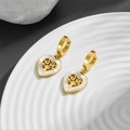 Orecchini a cuore dorati con albero della vita in madreperla bianca su sfondo elegante - Albero della Vita in Madreperla (2362621) / Oro Bianco
