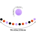 Detail view of 250cm Halloween garland with 3cm black, orange, and purple pom poms - Halloween Black Orange Purple Pom Pom Garland