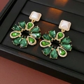 Close-up of vintage emerald green teardrop earrings with a white square pearl stud - Green-Emerald Corolla (HE23405)