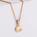 Detail view of gold C-letter pendant with brushed metal finish on a thin O-chain - Letter C