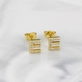 Elegant gold-plated stud earring in E-letter shape with pave-set zircon on marble surface - Letter E