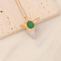 Detail of vintage bull head pendant necklace with green gemstone on beige textured stone - Green Gemstone White Bull Head (7#)