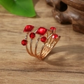 Elegant multilayer rose gold scarf ring with deep red gemstones on dark wood - One Size / Red (X2370)