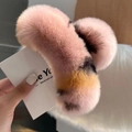 Close-up of pink leopard print faux rabbit fur claw clip with plush texture and soft spots - Lotus Pink (Large)