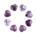 Set of 8 heart-shaped purple and white natural crystal gemstones in a circular layout - Phosphosiderite