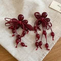 Detail of dark red resin bow earrings with tassel on natural linen background - Silver Earring Post - Red
