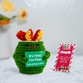 Detail of handmade crochet emotional support pickle with Christmas card and greeting - Fire Extinguisher + Card