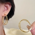 Luxury gold interlocking double circle earrings with zircon stones on model - Gold Double Interlocking Loop (E2364 Gold) / 925 Silver Needle / Gold