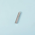 Close-up of polished silver cylindrical nesting pendant with top ring and opening mechanism - Steel Color (Inner) + Steel Color (Outer)