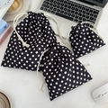 Three-piece black polka dot drawstring storage bags for cosmetics in various sizes - Black Polka Dots