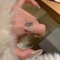 Golden butterfly ring with purple wings, gold veins and rhinestones on a female hand - Purple Rhinestone Butterfly Style (J3307)