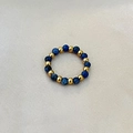 Elastic beaded ring featuring natural blue lapis stones and golden stainless steel beads - Blue Vein Stone