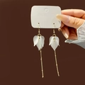 Elegant white petal drop earrings with gold long tassels and pearl accents on card - White Frosted Resin Petal Tassel (E2859-2)