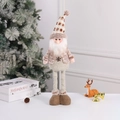 Standing Christmas gnome with long legs in warm brown knitted fabric and snowflake embroidery - Santa Claus / Small
