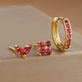 Macro detail of gold earrings set with red marquise gems and sparkling pavé hoops - Gold-Rose Red (3 Pcs Set)