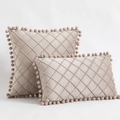 Set of two beige velvet pillows with diamond quilted patterns and pom-pom trim accents - Champagne Pink