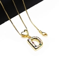 Macro detail of gold-plated D-letter pendant with colorful zircons on box chain - Pendant with Necklace / Letter D